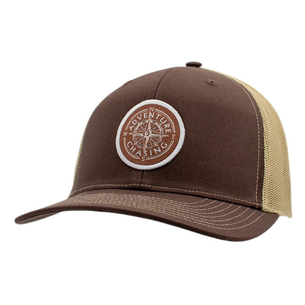 Brown trucker hat with a circular logo that says 'Adventure Chasing'.