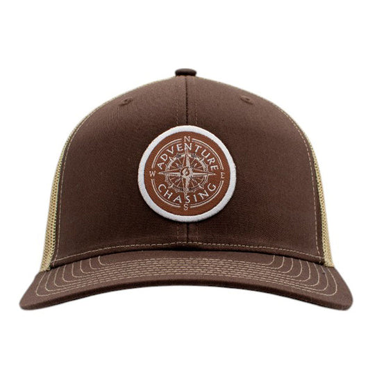 Brown cap with a circular 'Adventure Chasing' logo on the front.