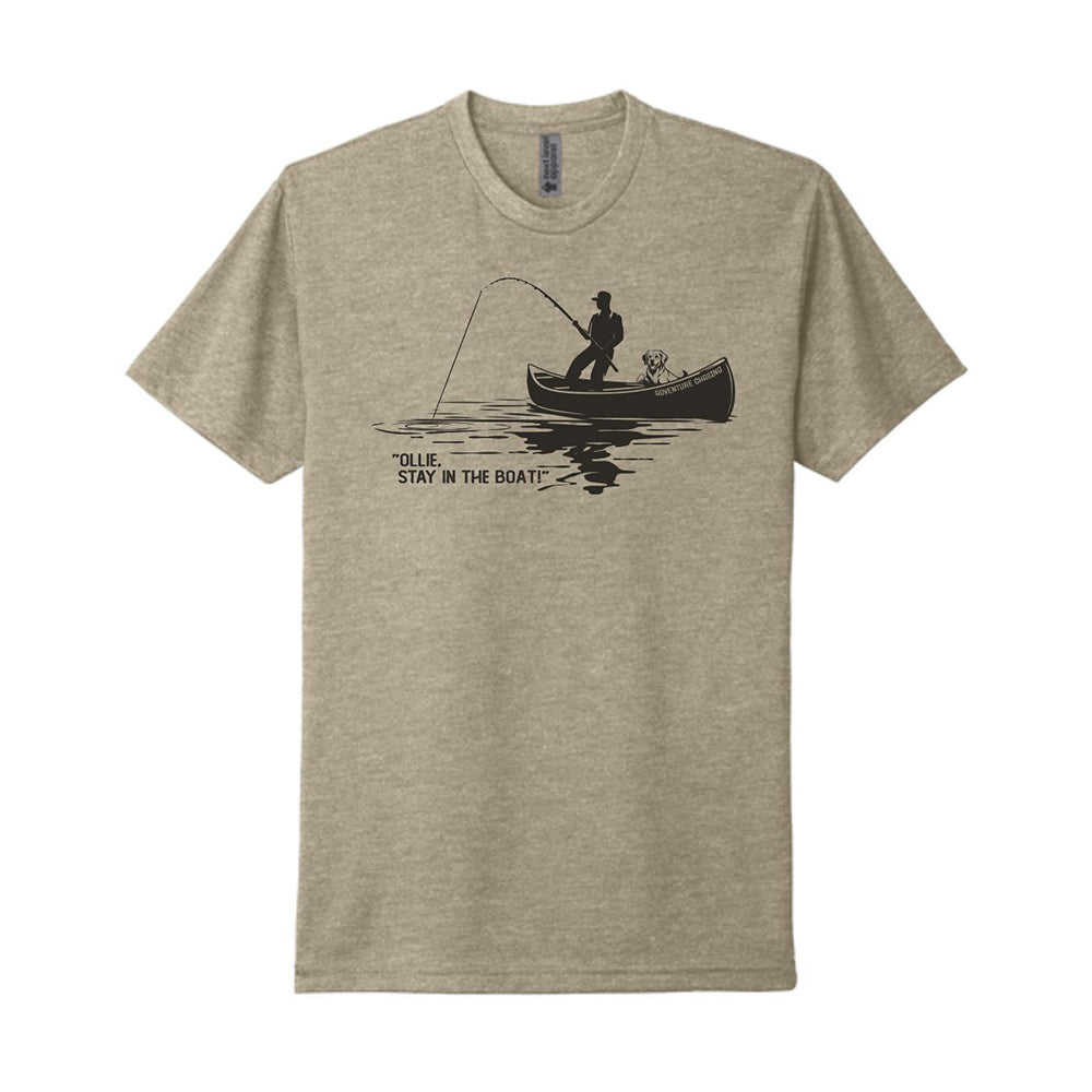 Beige t-shirt with a graphic of a man in a canoe with a dog and the text "Ollie, stay in the boat!"